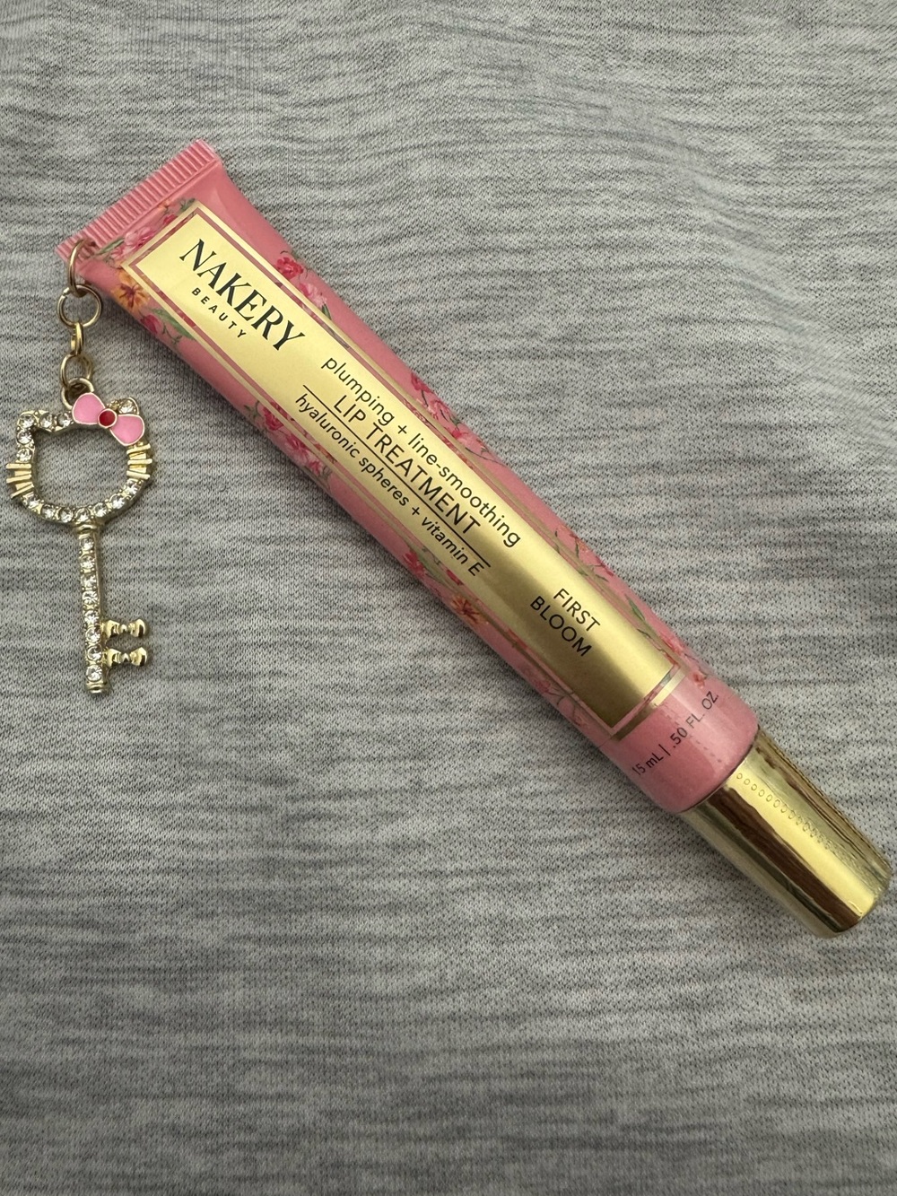 Nakery Beauty Plumping Lip Treatment Birthday Suit with custom charm